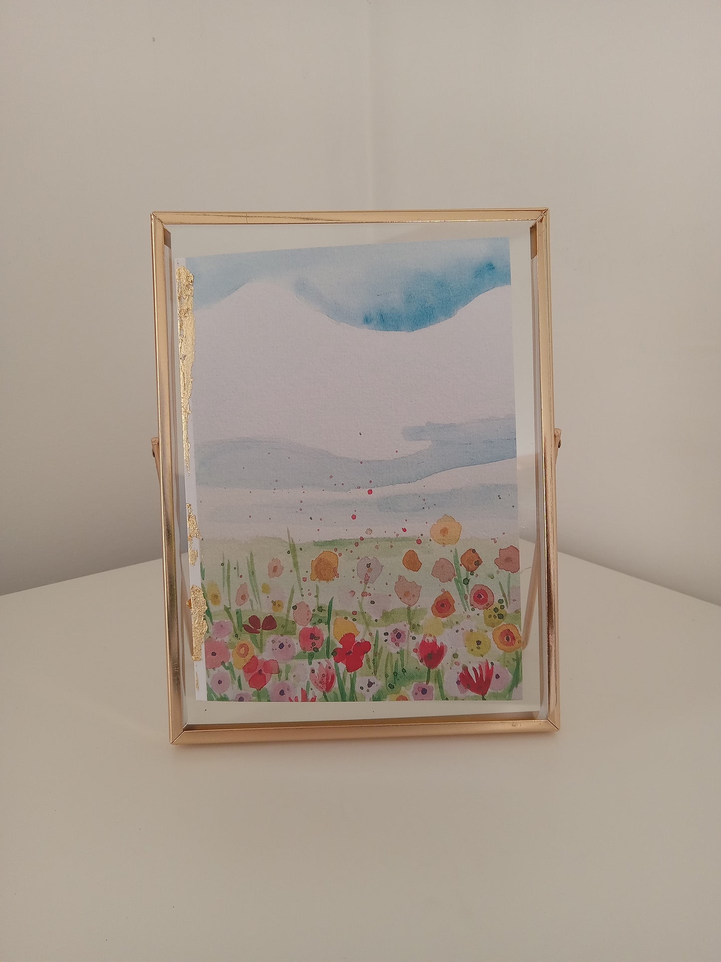 frameable greeting card, one floral, in a gold frame